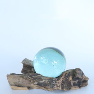 Small glass ball on recycle wooden